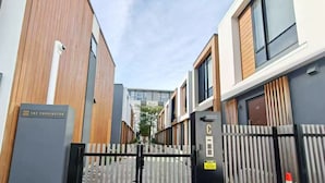 A modern building with a sign reading "The Paddington".