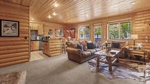 A log cabin interior with a living room, kitchen, and dining area. - Abode at Black Bear #207, hot tub, pool & gym, Deer Valley (Park City)