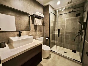 Shower, hair dryer, towels, soap