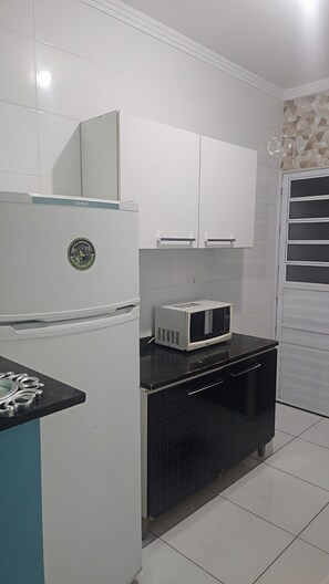 Fridge, microwave, stovetop, cookware/dishes/utensils