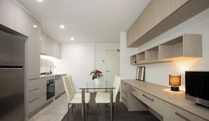 Fridge, microwave, oven, stovetop - KozyGuru | Epping | Stylish 1 Bedroom Apartment (Epping)
