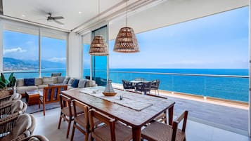 Luxury Penthouse, 4 Bedrooms, Pets Allowed, Ocean View | Living area | 49-inch Smart TV with cable channels