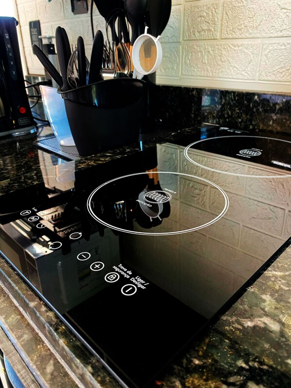 Fridge, microwave, stovetop, coffee/tea maker