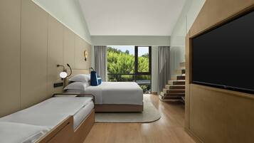 家庭樓中樓客房, 花園景 | 羽絨被、迷你吧贈品、房內夾萬、書桌