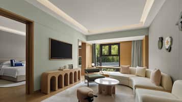 Deluxe Suite, Garden View (Family) | Down comforters, free minibar items, in-room safe, desk