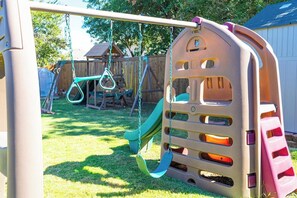 Children’s area - Spacious 3-Bedroom Retreat in Corinth, Texas. with a private backyard, playground, BBQ patio, and fully equipped kitchen. Just minutes from Lake Lewisville, Oakmont Golf Course, and a short drive to Dallas, Plano, and McKinney. (Corinth)