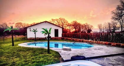 Spacious 4BR ranch for up to 13 on 5 private acres near Saint Jo wineries. Features a pool, hot tub, firepit, chef’s kitchen, wine lounge, Smart TV, and pet-friendly options—perfect for family trips and wine weekends.