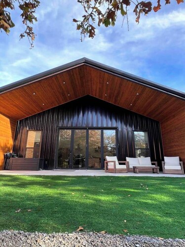 Relax on 3 peaceful acres at this Modern Rustic Barndominium in Nocona. This 2BR, 2BA retreat offers an open layout, chef’s kitchen, spa-style baths, and outdoor patio with fire pit—perfect for families, couples, or friends under the Texas stars.