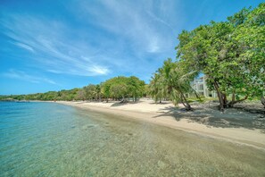 On the beach, sun loungers, beach towels
