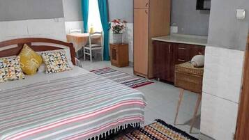 Family Quadruple Room, Garden View | Iron/ironing board, free WiFi