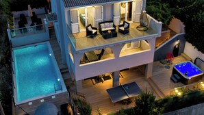 A two-story house with a swimming pool, outdoor seating, and a hot tub. - Vila Perla Slatine - Charming 4-bedroom villa with Pool (Slatine)