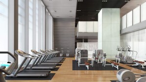 A modern gym with treadmills, elliptical machines, and weight equipment. - Blueground | DIFC, pool, nr Dubai Mall (Dubai)