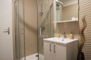 Shower, hair dryer, towels, soap