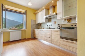 Fridge, dishwasher, coffee/tea maker, cookware/dishes/utensils