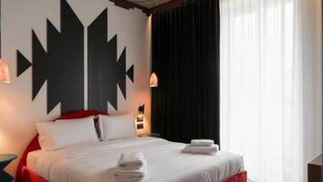 Premium bedding, down comforters, memory foam beds, minibar