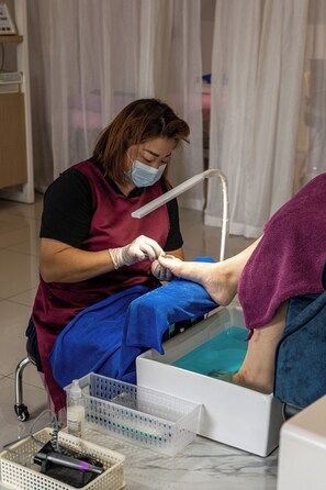 Guests can receive expert care in a clean and organized setting with a treatment table and medical supplies.