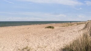 A sandy beach with the ocean in the background. - "Naina" - 200m from the sea by Interhome (Grenaa)