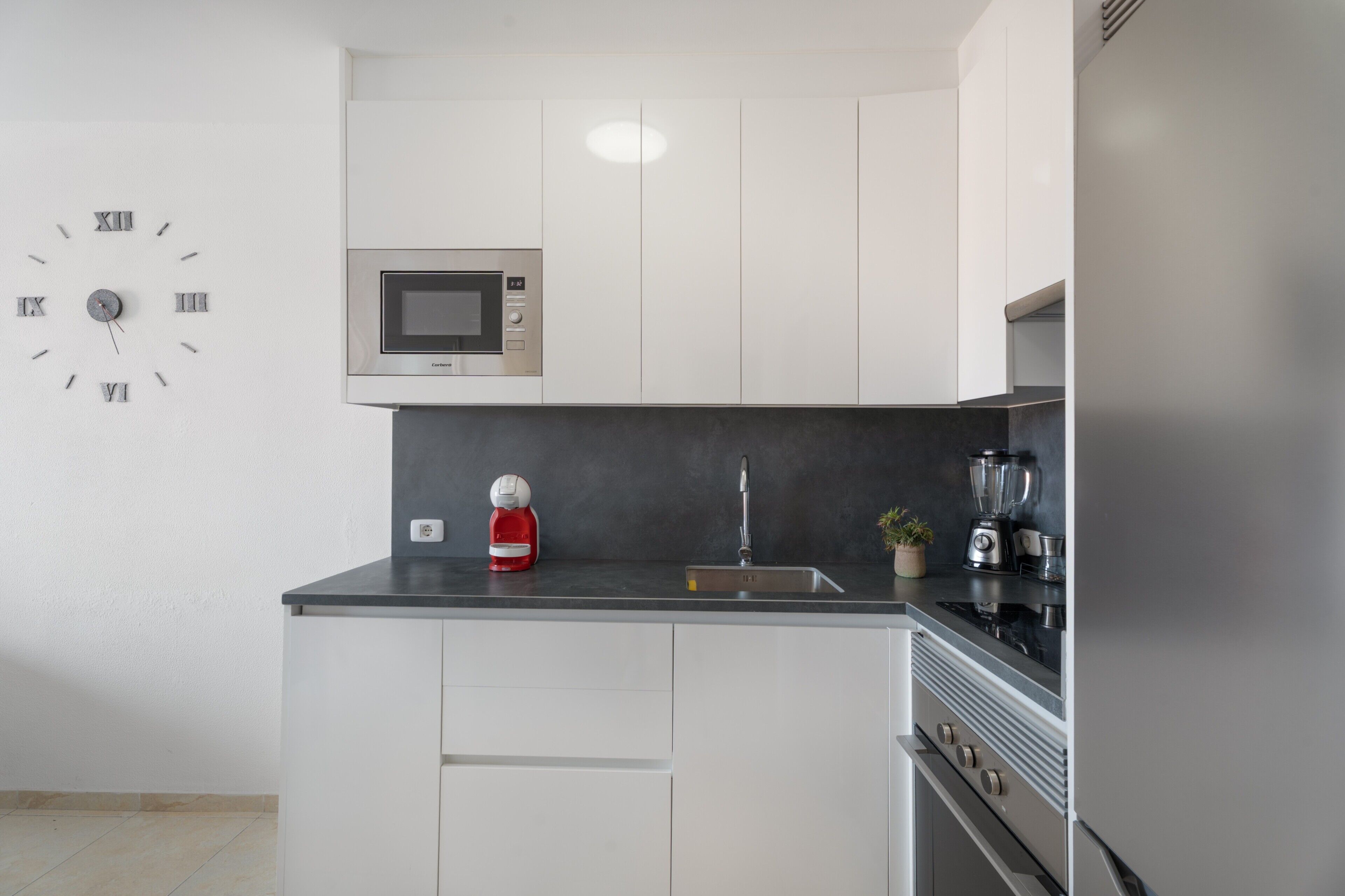 Fridge, microwave, stovetop, coffee/tea maker