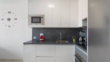 Fridge, microwave, stovetop, coffee/tea maker