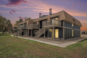 A modern two-story house with a balcony, a staircase, and a chimney. - 2BR townhouse w/ Byers Peak views (Fraser)