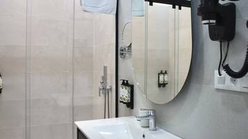 Hair dryer, towels, soap, shampoo