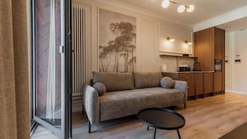 Apartment, Balcony, City View | Living area | Flat-screen TV