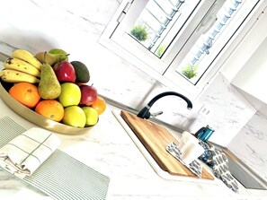 Fridge, oven, coffee/tea maker, cookware/dishes/utensils