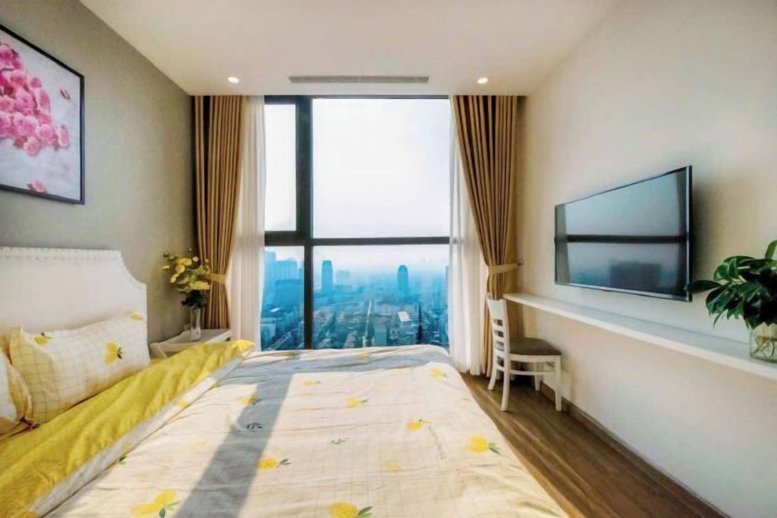 Premium bedding, desk, laptop workspace, blackout drapes