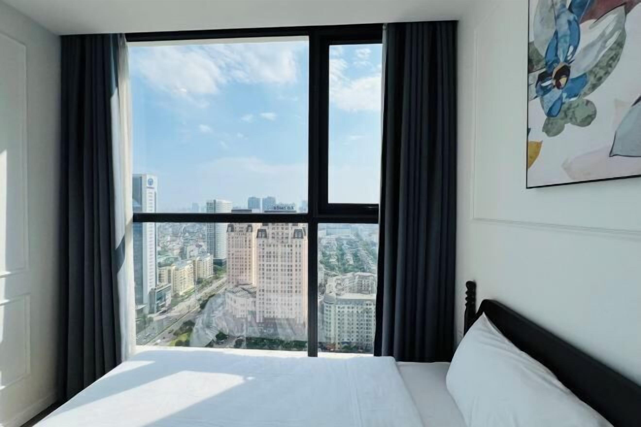 Premium bedding, desk, laptop workspace, blackout drapes