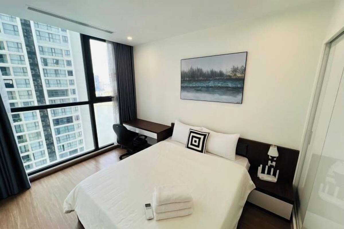 Premium bedding, desk, laptop workspace, blackout curtains