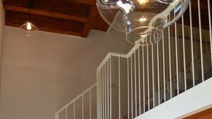 A staircase with white railings, a wooden ceiling, and patterned floor tiles. - Old Farmhouse "Green Apt",trekking lovers vacation homes with splendid views (Ravello)