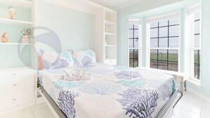 A bedroom with a bed, a nightstand, a dresser, and a window with a view of the outdoors. - Sandy Shores - Babe's Beach / Welcomes 8 (Galveston)