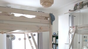 A room with a bunk bed, a ladder, a desk, a chair, a bookshelf, and a wardrobe. - Appartement Village Daguerre Citycosy (Paris)