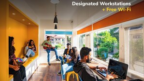 A modern workspace with designated workstations and free Wi-Fi. - goSTOPS Srinagar (Srinagar)