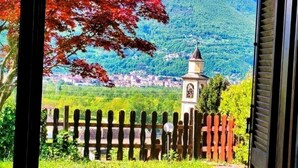 A room with a view of a mountain, a wooden fence, and a small tower. - LA VILLETTA (Piemonte)