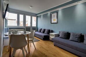 City Apartment | Living room | Flat-screen TV - RentPlanet - Apartament Szewska (Wroclaw)