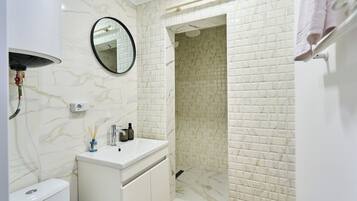 Shower, hair dryer, towels, soap