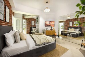 Premium One-Bedroom Apartment, Balcony, Inner Court View | Minibar, in-room safe, individually decorated, individually furnished