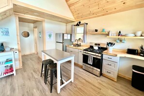 Fridge, microwave, oven, stovetop - The Beach Bum | Modern Cabin on the Sand (Burnham)