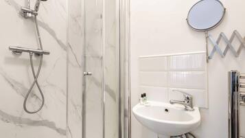 Shower, hair dryer, towels