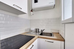 Fridge, high chair, cookware/dishes/utensils