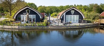 Modern House on a Pond in a Wooded Area