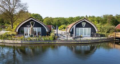 Modern House on a Pond in a Wooded Area