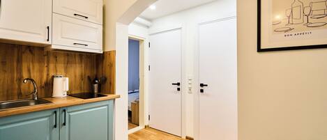 Fridge, microwave, stovetop, coffee/tea maker