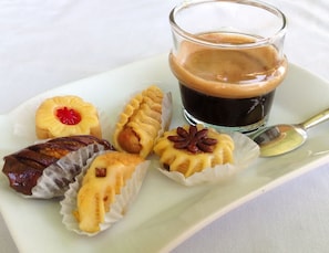 A plate of assorted pastries with a cup of coffee. - Charming Mini Riad 2 Bedrooms Shared Pool (Marrakech)
