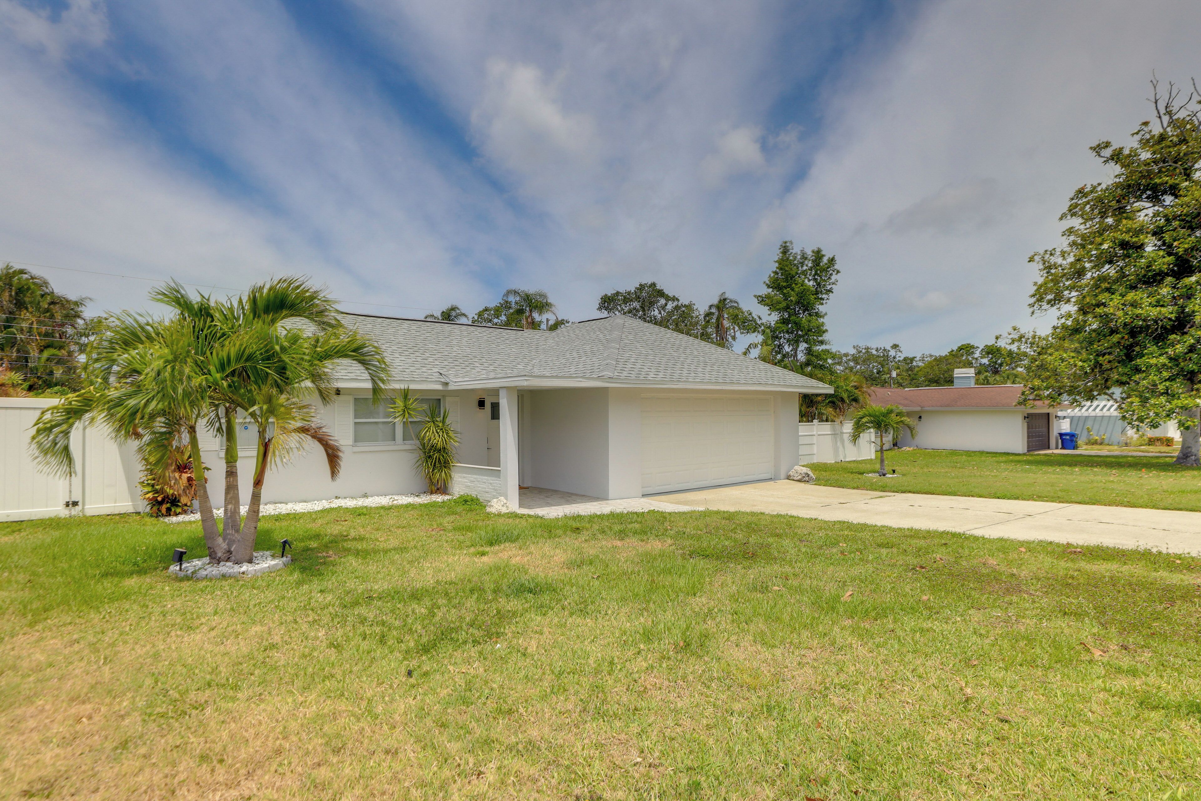 A single-story house with a flat roof and a small front yard.
