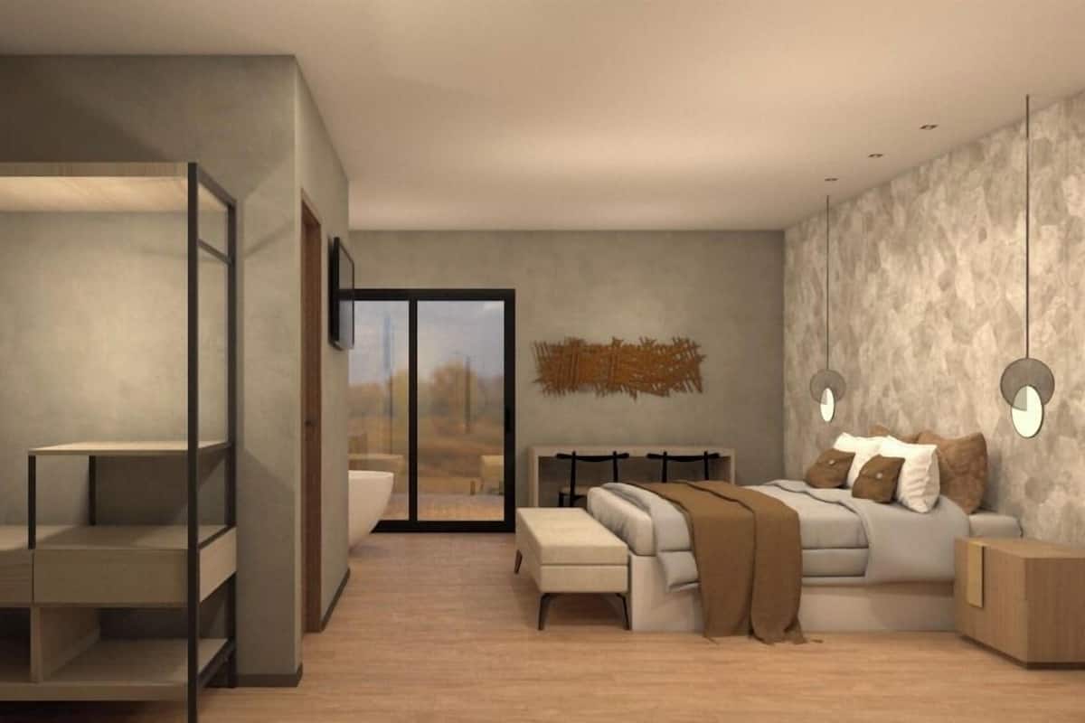Una sala de estar moderna con un sofá, una mesa de centro y una estantería empotrada.