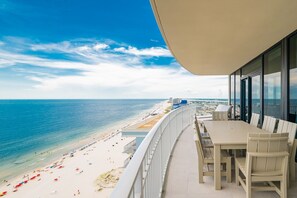A balcony with a view of a beach and ocean. - Phoenix Gulf Shores Ii 2201 4 Bedroom Condo (Gulf Shores)