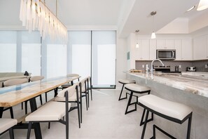 Condo, 4 Bedrooms | Private kitchen | Fridge, oven, coffee/tea maker