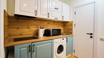 Fridge, microwave, stovetop, coffee/tea maker